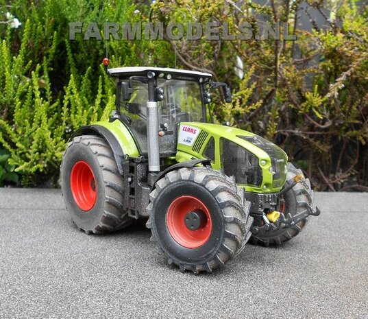 421. Claas Axions 900 serie op brede banden