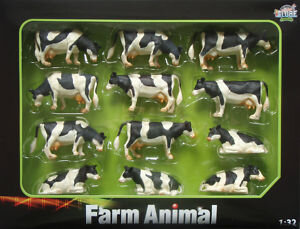 12 zwartbonte staande koeien (4 staande, 4 grazende en 4 liggende koeien) 1:32 571929