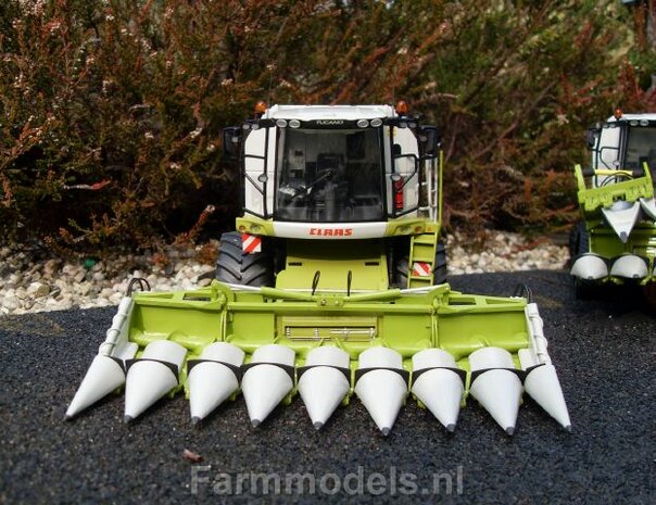 409. Claas Tucano (eventueel op rupsen) met kolvenplukker